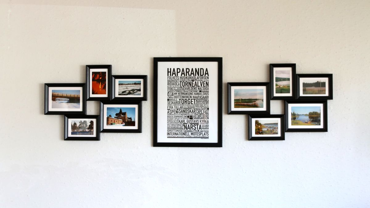 A coordinated arrangement of black picture frames on a wall